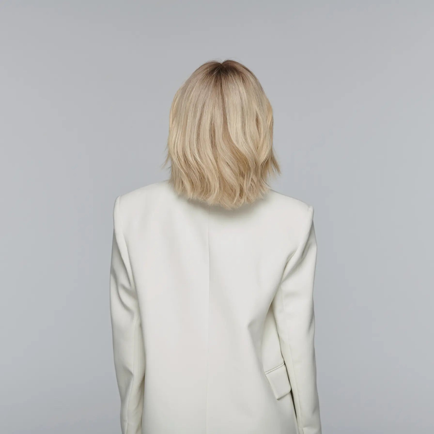 Back view of the Healthy Butter Blonde Chic Bob by Madeline Aken, showing smooth, even layers and a natural butter-blonde gradient that transitions seamlessly from root to tip.