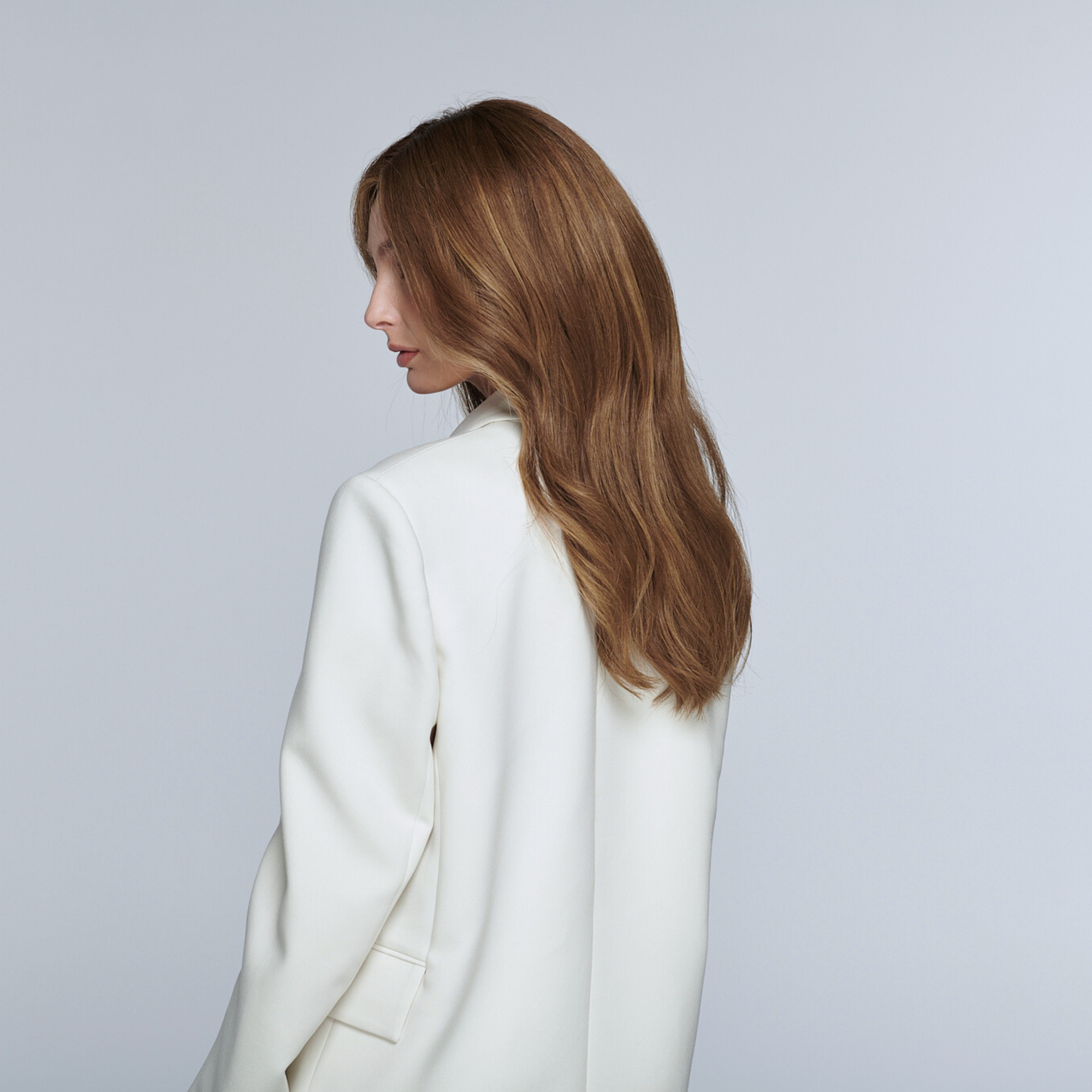 Back view of Teddy Bear Broned 20-inch Remy hair wig showing length, smooth texture and subtle highlight blending