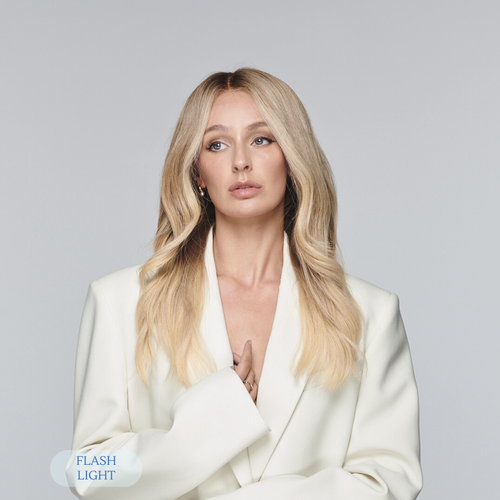Model wearing Madeline Aken’s Fits All creamy blonde wig, showcasing a refined, soft neutral tone and face-framing layers that flatter every complexion.