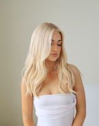 Pearle pearl blonde lace top wig in natural daylight showing a clean luminous blonde finish