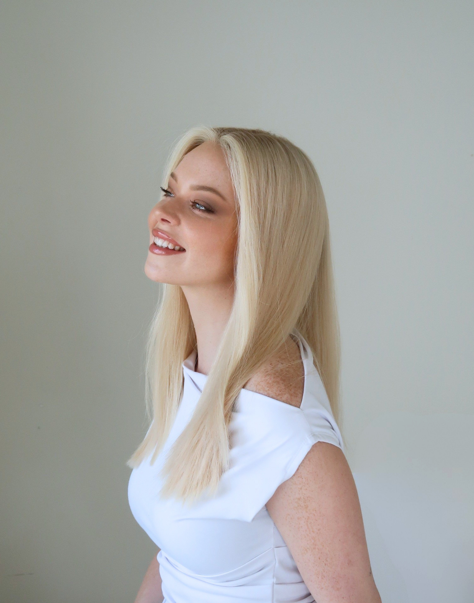 Soft pearl-toned blonde lengths on Pearle human hair wig