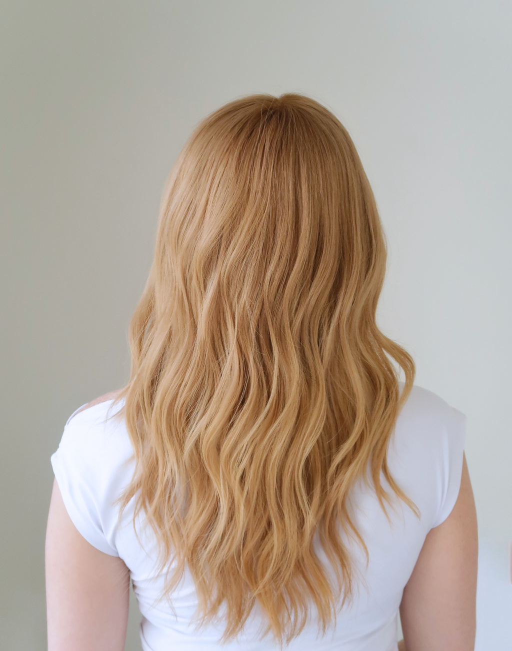 Back view of Apricot ginger blonde wig showing soft apricot and golden tones