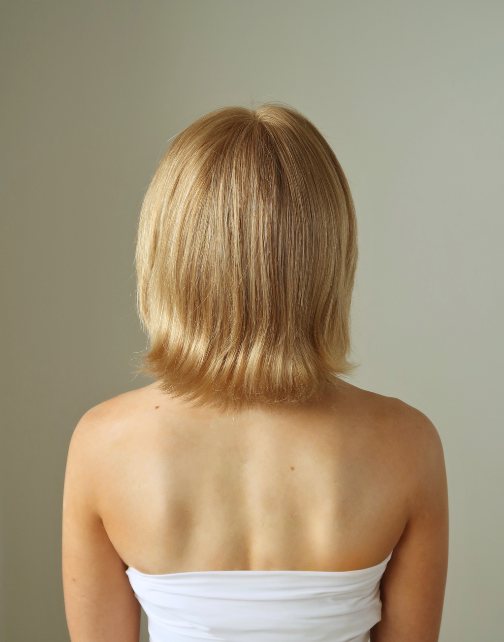 Back view of Aurelia golden blonde bob showing natural tonal variation