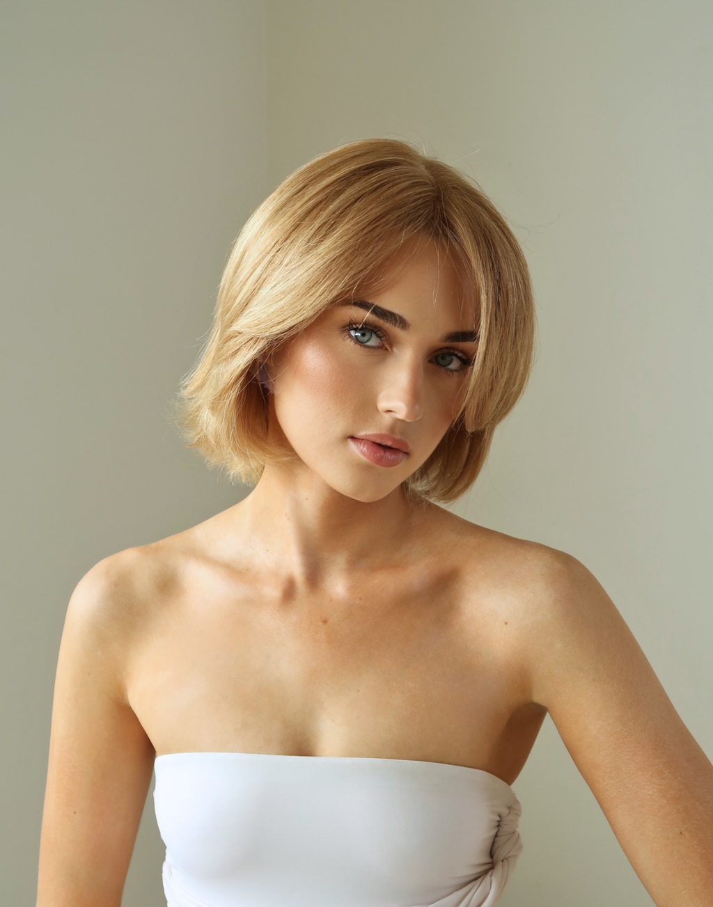 Front view of Aurelia natural golden blonde raw European hair wig