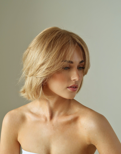 Aurelia raw European hair wig in natural light showing soft wheat blonde tones