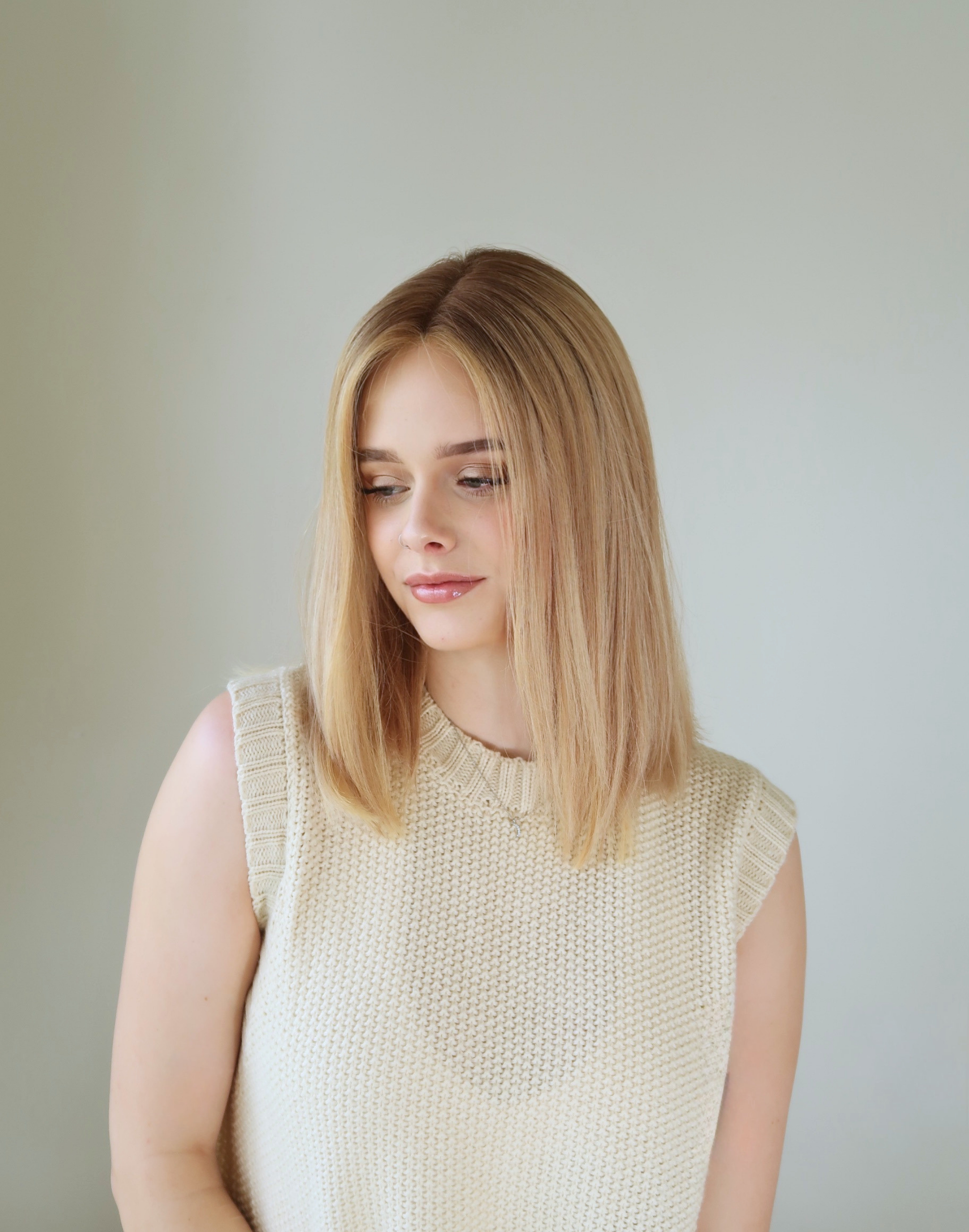 Blended Level 7 beige and Level 8 natural blonde tones on Mica Remy human hair wig