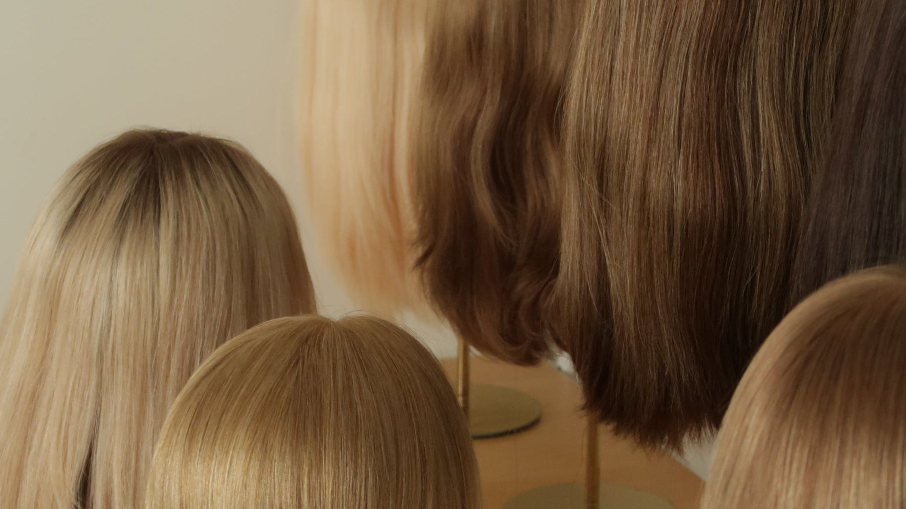 Styling tools, hair swatches, and a notepad arranged on a work surface, representing Madeline Aken's private wig consultation service