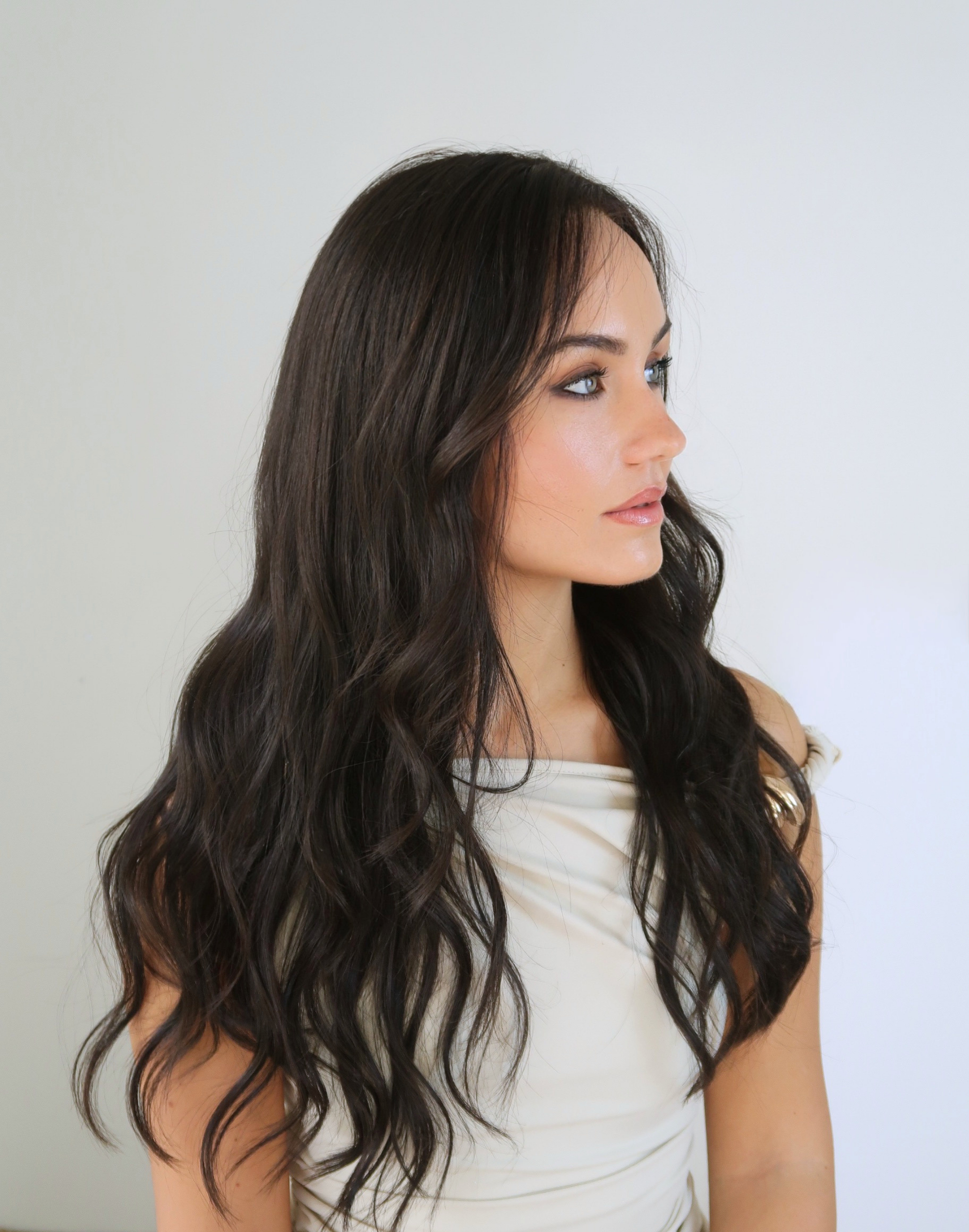 Side profile of Sable raw human hair wig in a naturally dark shade