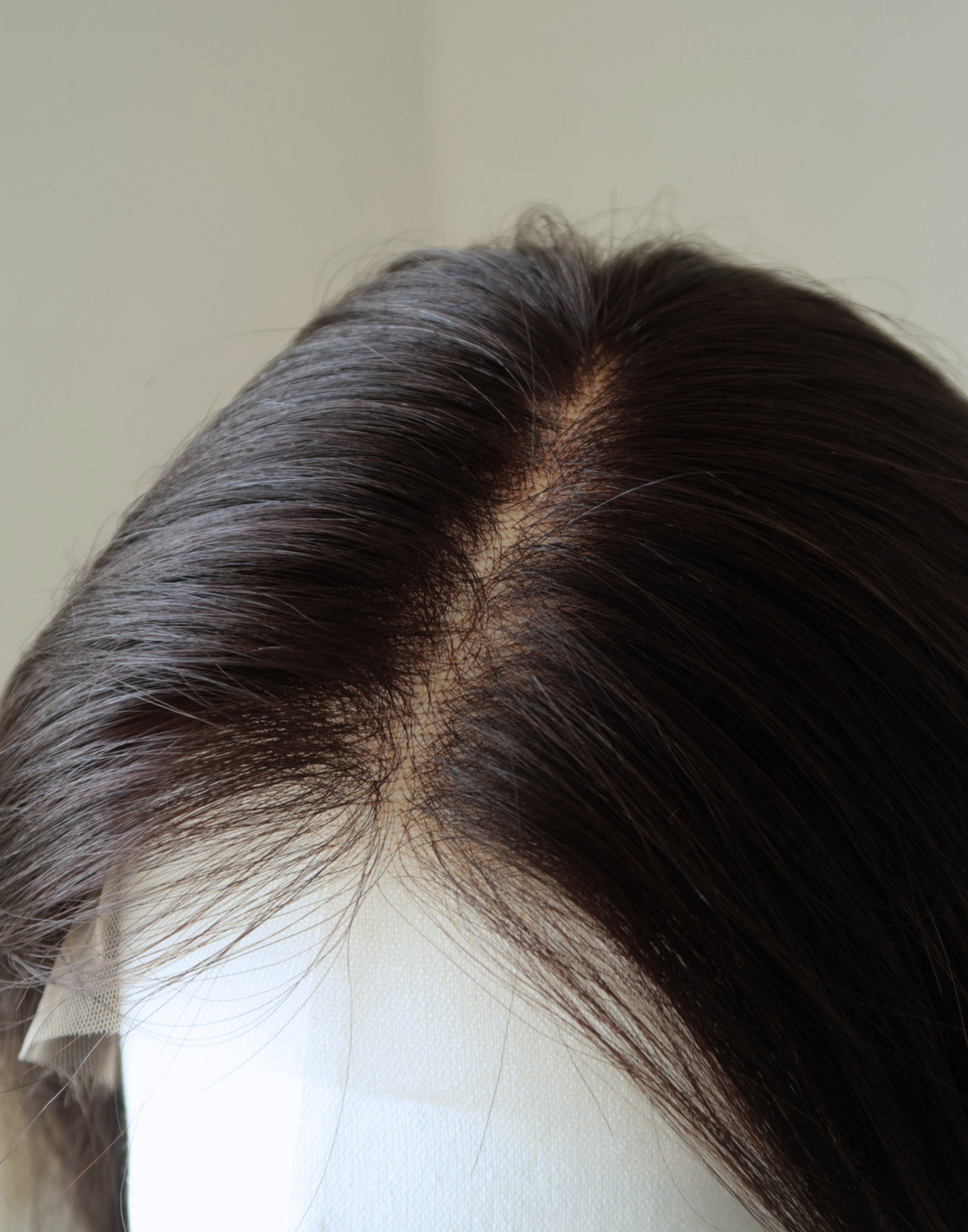 Lace top parting detail on Sable natural black raw human hair wig