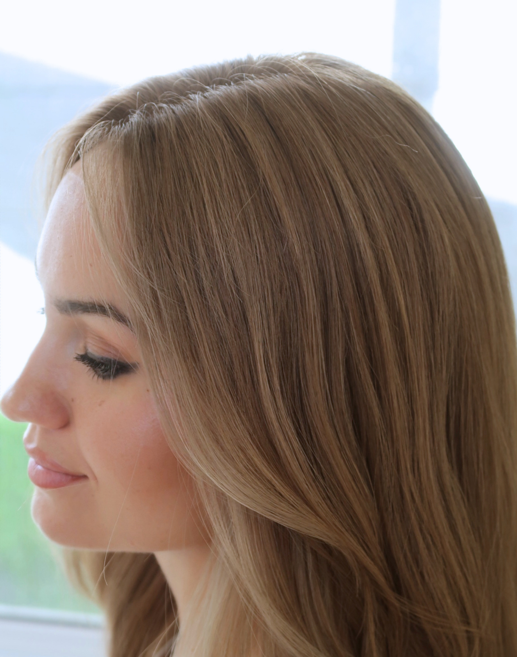 Tawny brown human hair wig styled in waves to reveal richer tonal dimension