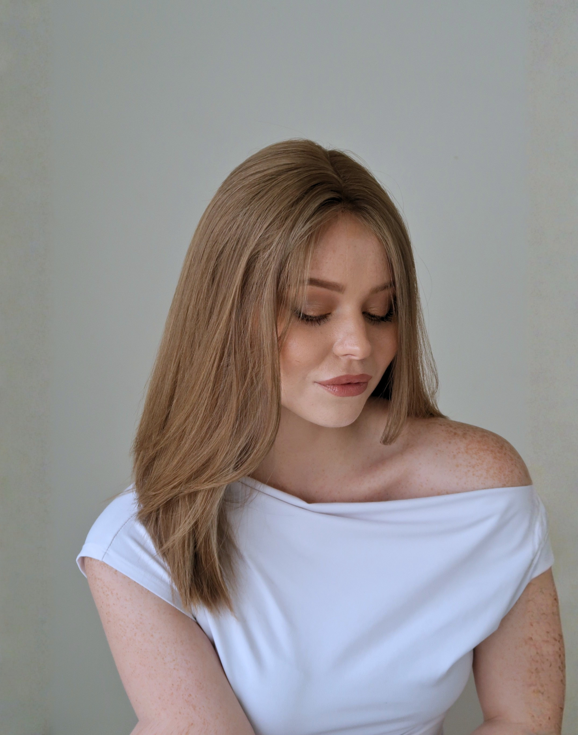 Side profile of Tawny soft brown human hair wig with a gently deepened root