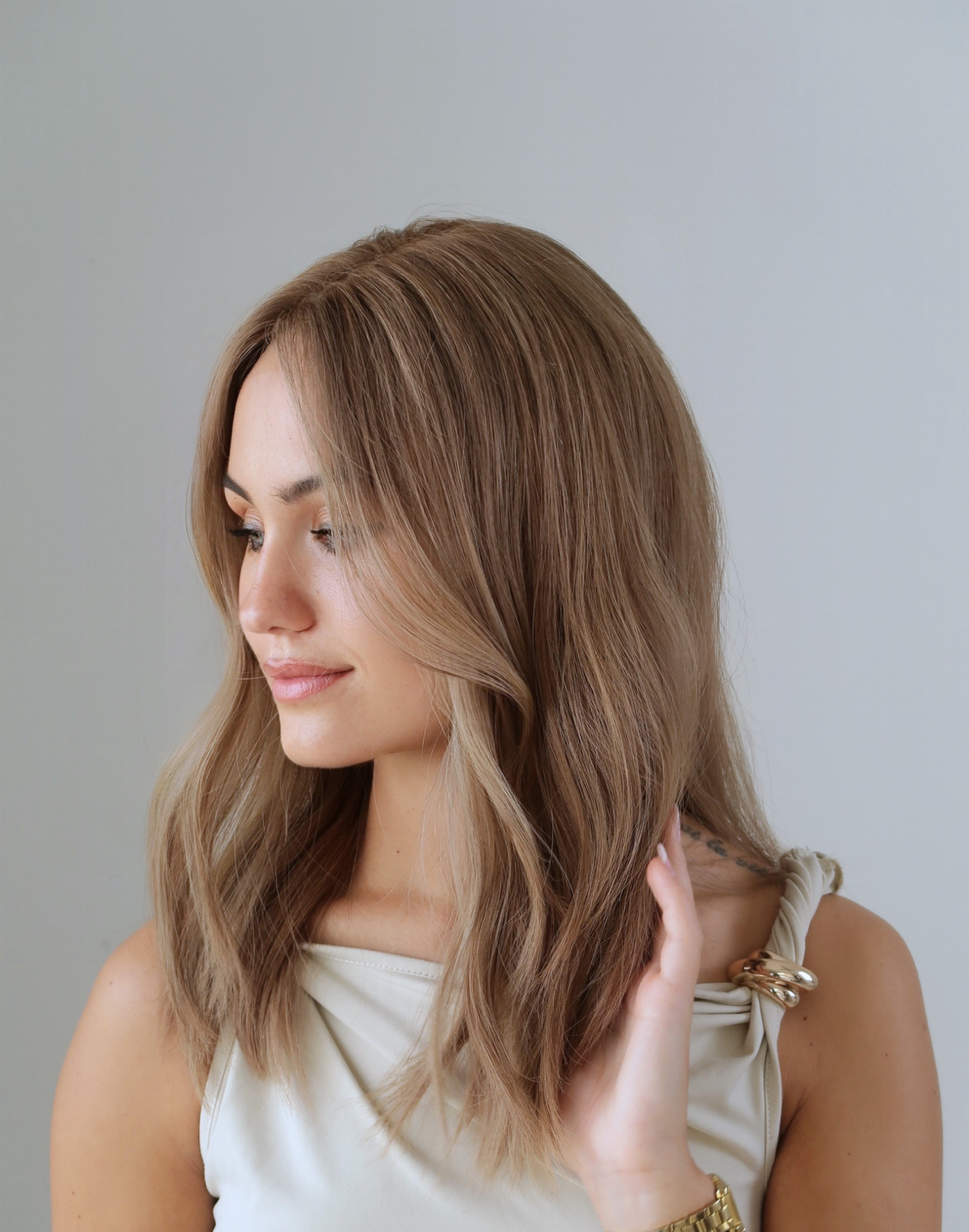 Model wearing Tawny glueless Remy human hair wig with a smooth natural finish