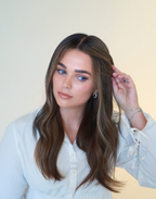 Truffle brunette lace top wig in natural daylight showing contrasting toffee highlights