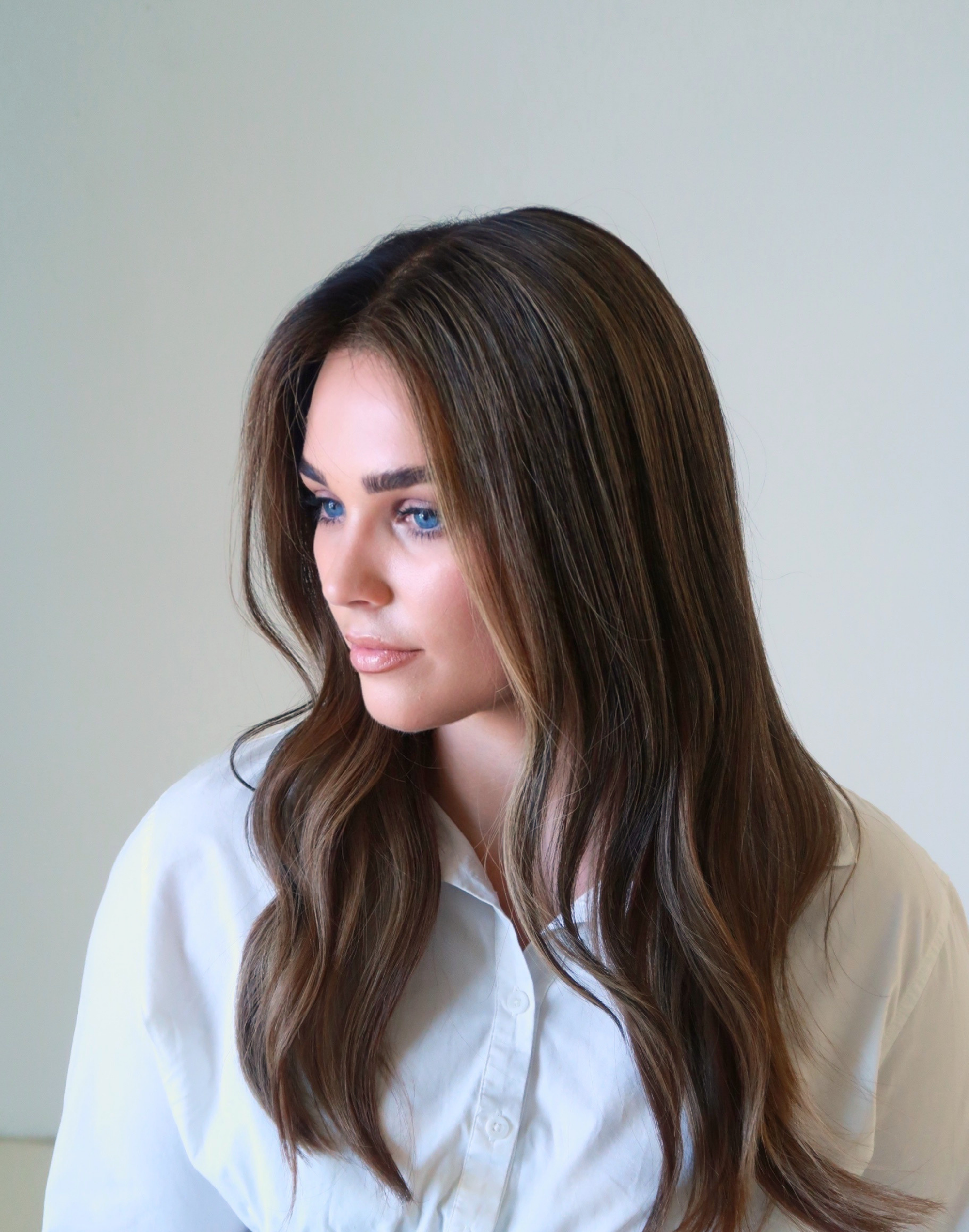 Model wearing Truffle deep brunette glueless human hair wig with natural movement