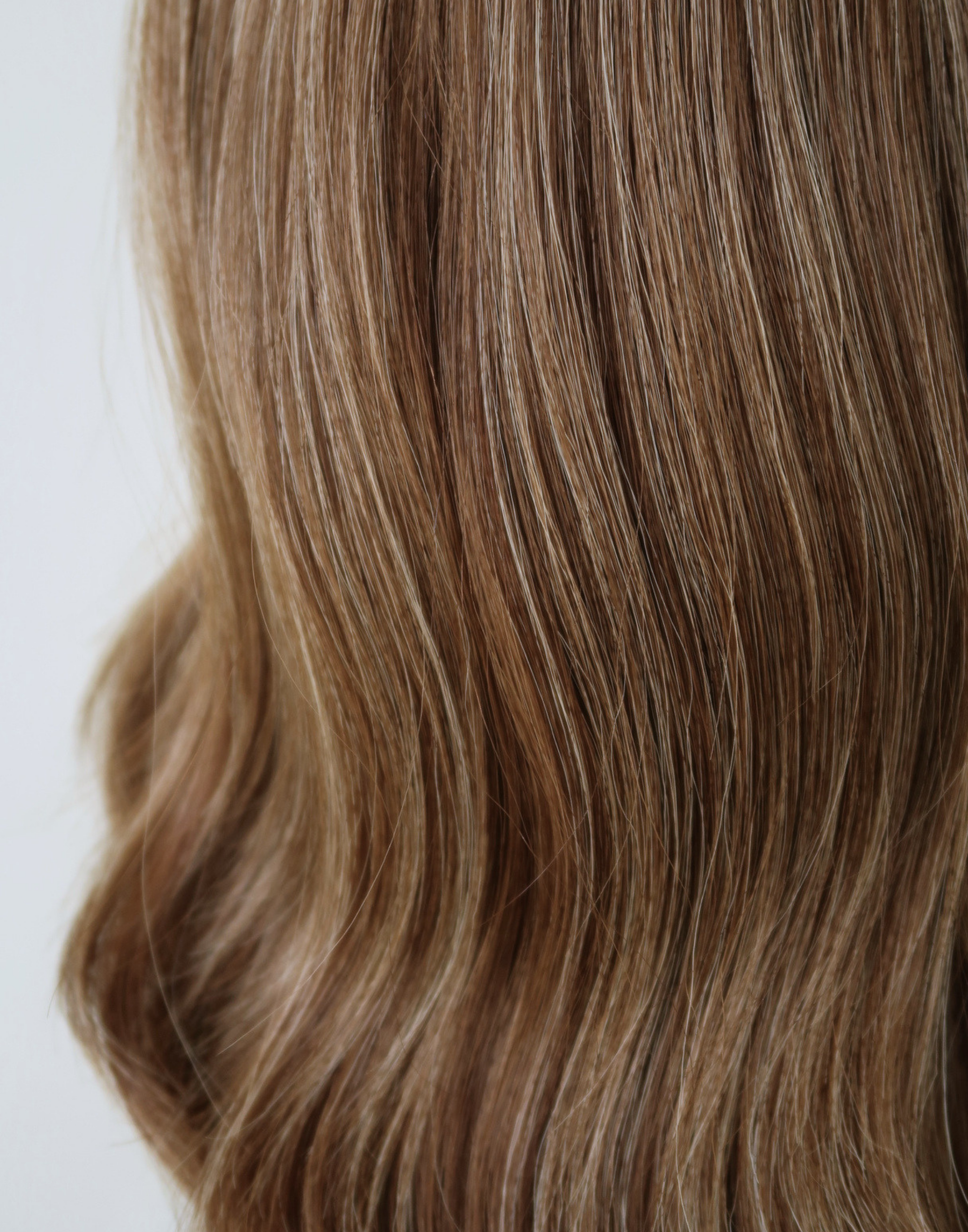 Model wearing the Marlowe Remy human hair wig, showing its natural movement, realistic density and hair texture in daylight.