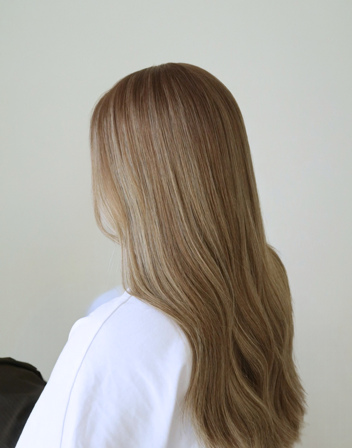 Close-up of Serein glueless human hair wig showing dimensional mushroom bronde color and finely blended ash brown highlights.
